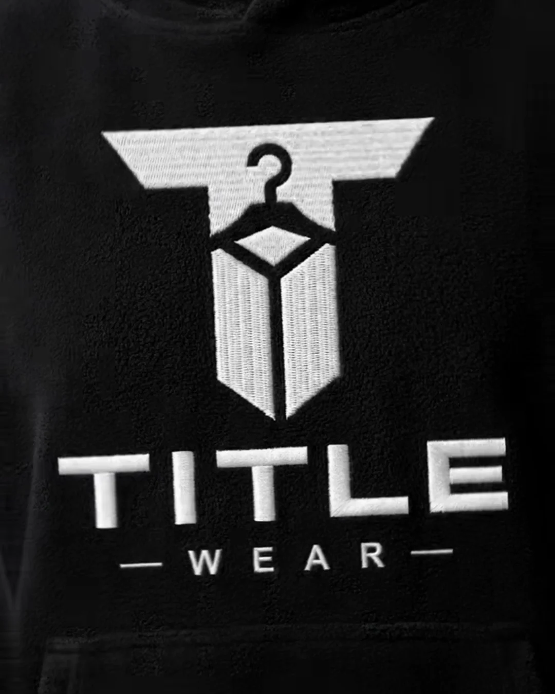 Title Wear logo printed on a black hoodie