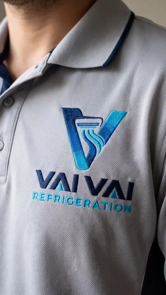 Vai Vai Refrigeration logo on a grey polo shirt